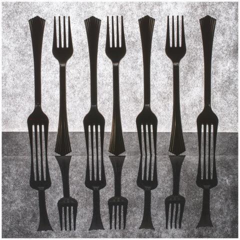 Symmetrical arrangement of black forks reflected o