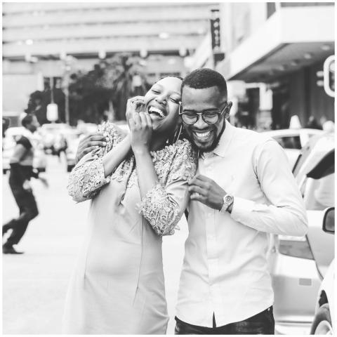 Happy couple enjoying a fun moment on the street.