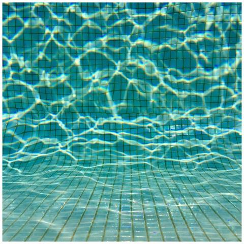 Captivating view of swimming pool tiles underwater