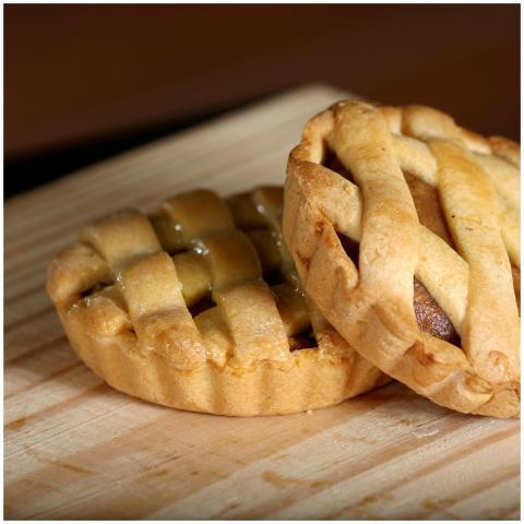 Two delicious homemade mini apple pies with a latt