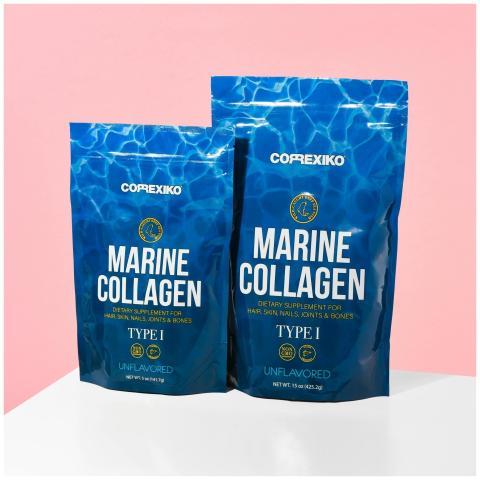 Close-up of marine collagen packaging on a pink ba
