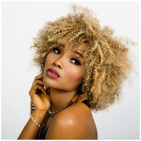 Elegant portrait of a woman with golden curly hair
