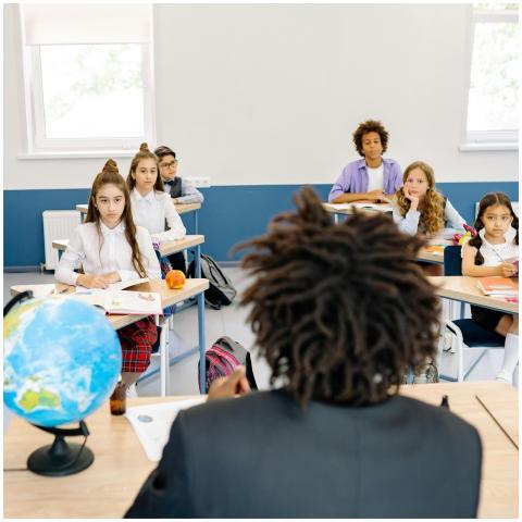 Diverse group of students attentively listening to