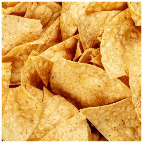 A detailed shot of golden, crispy tortilla chips,