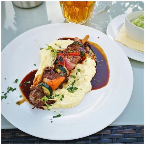 Close-up of delicious kebabs on creamy mashed pota