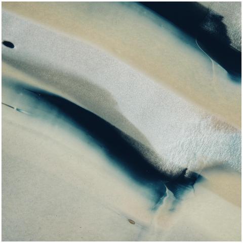 Abstract image featuring fluid blue and white patt