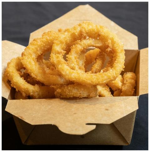 Crispy, golden onion rings served in a takeout box