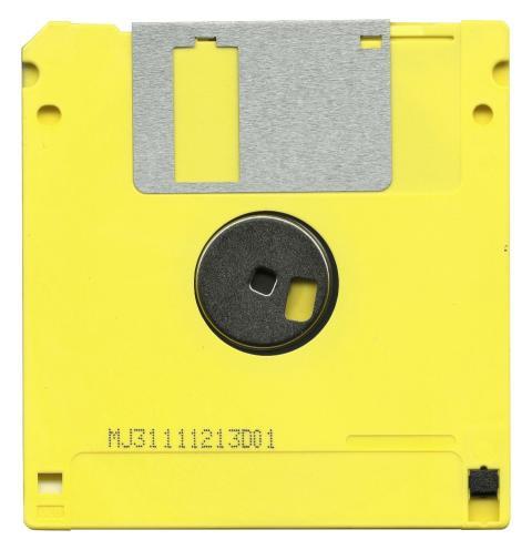 Retro yellow floppy disk showcasing classic data s