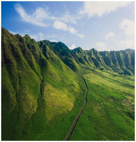 A stunning aerial view of green mountains in Hawai
